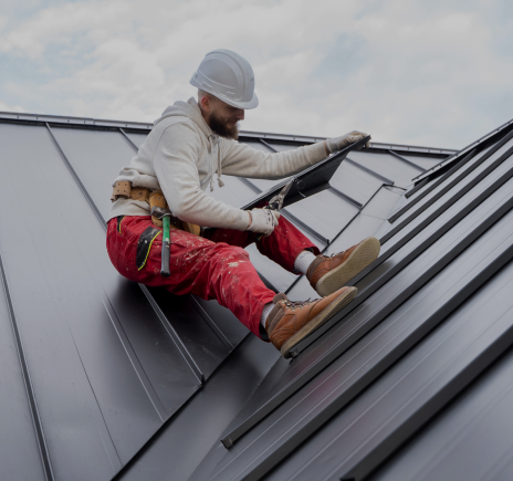 Full shot roofers working together with helmets